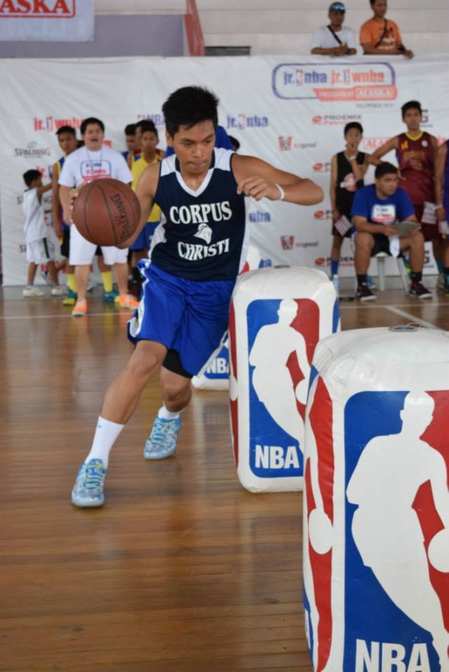RSC participants weave their way through the NBA Logo Men at the Dribbling Station. 