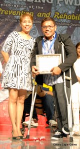 Ramil Jaictin receives his certificate of participation from the organizers.