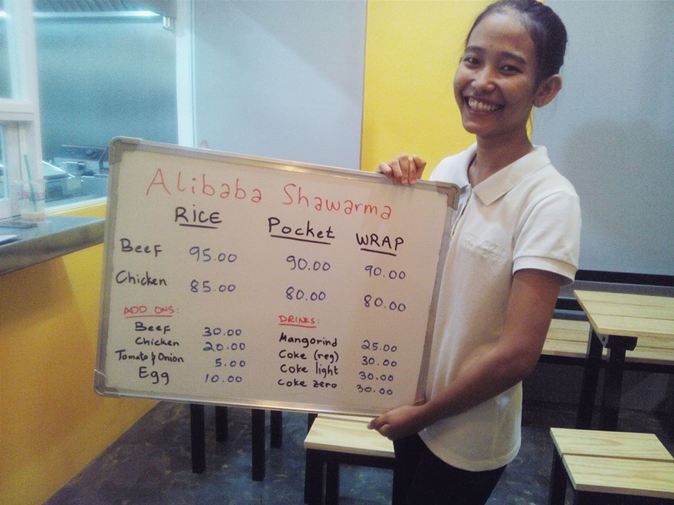 Their most bubbly crew showing us the temporary menu. Keep up the energy ate! Your personality adds brightness to Alibaba Shawarma. Great Job!